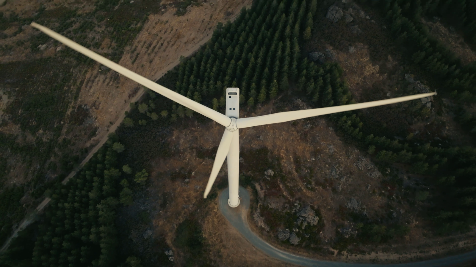 Aerial photo of a wind turbine, looking down from above.
