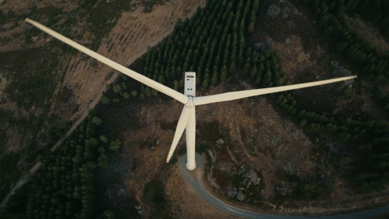 Aerial photo of a wind turbine, looking down from above.